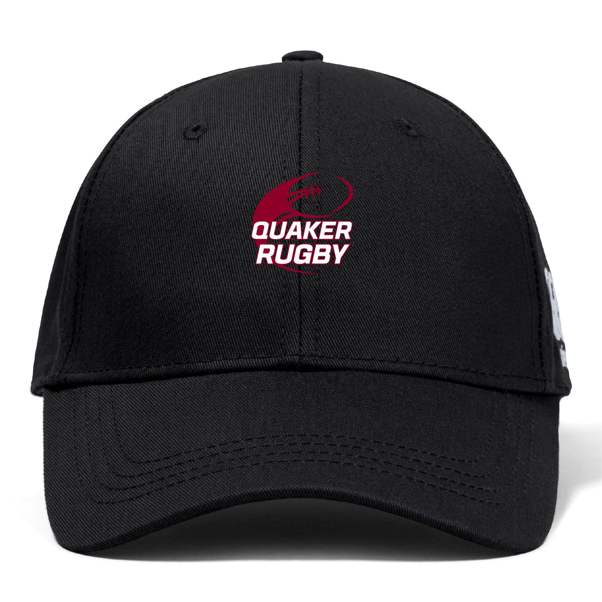 The Guilford College Flexfit Drill Cap by EMB Canterbury is a black cap with a curved brim, featuring a red and white "QUAKER RUGBY" logo and rugby ball graphic on the front for sporty style and comfort.