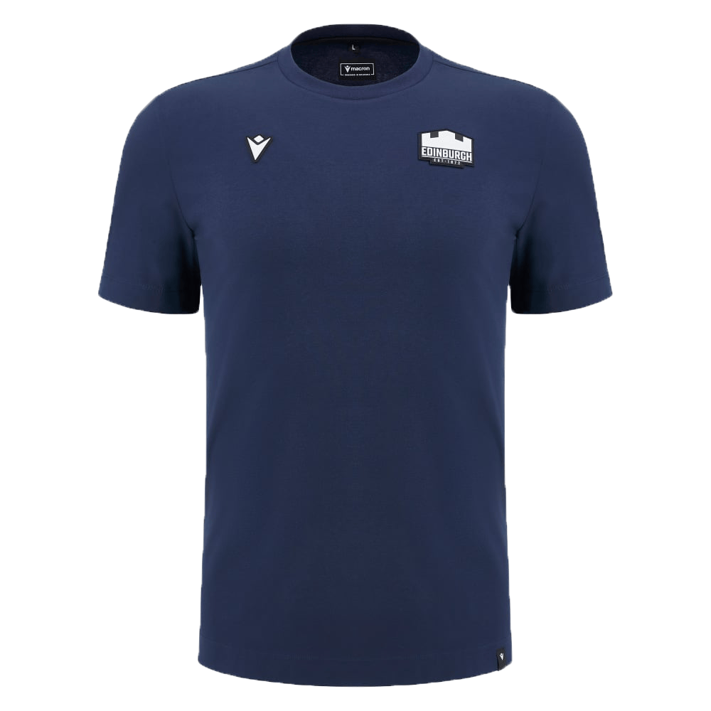 The Edinburgh 24/25 Anthem Travel Cotton T-Shirt by Macron is a navy blue athleisure tee crafted from heavyweight cotton, featuring a small white stylized logo on the upper left and a larger "Edinburgh" logo on the right.