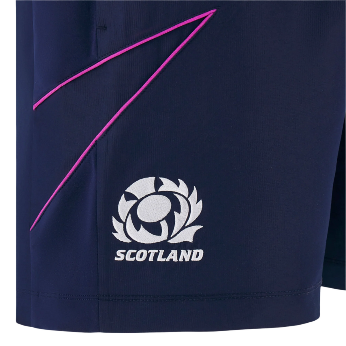 Close-up of the Macron Scotland 25/26 Player Training Shorts in navy, showcasing "Scotland" lettering, a white thistle emblem, and thin pink lines as part of the athletic design.