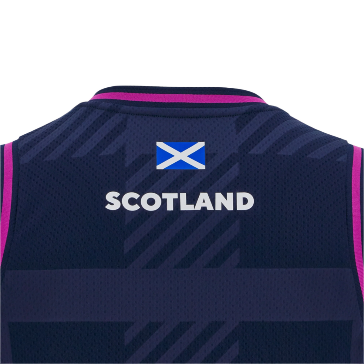 The Scotland 25/26 Basketball Singlet by Macron features a dark blue design with pink trim, the Scottish flag above "Scotland" in white, and is made from breathable performance fabric for comfort on and off the court.