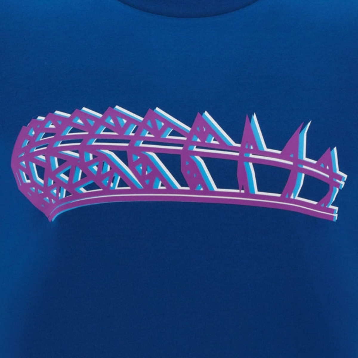 A bold geometric purple and blue crown graphic on a blue background adorns the Scotland 25/26 Murrayfield Stadium T-Shirt by Macron, capturing the stadium's spirit in stylish detail.