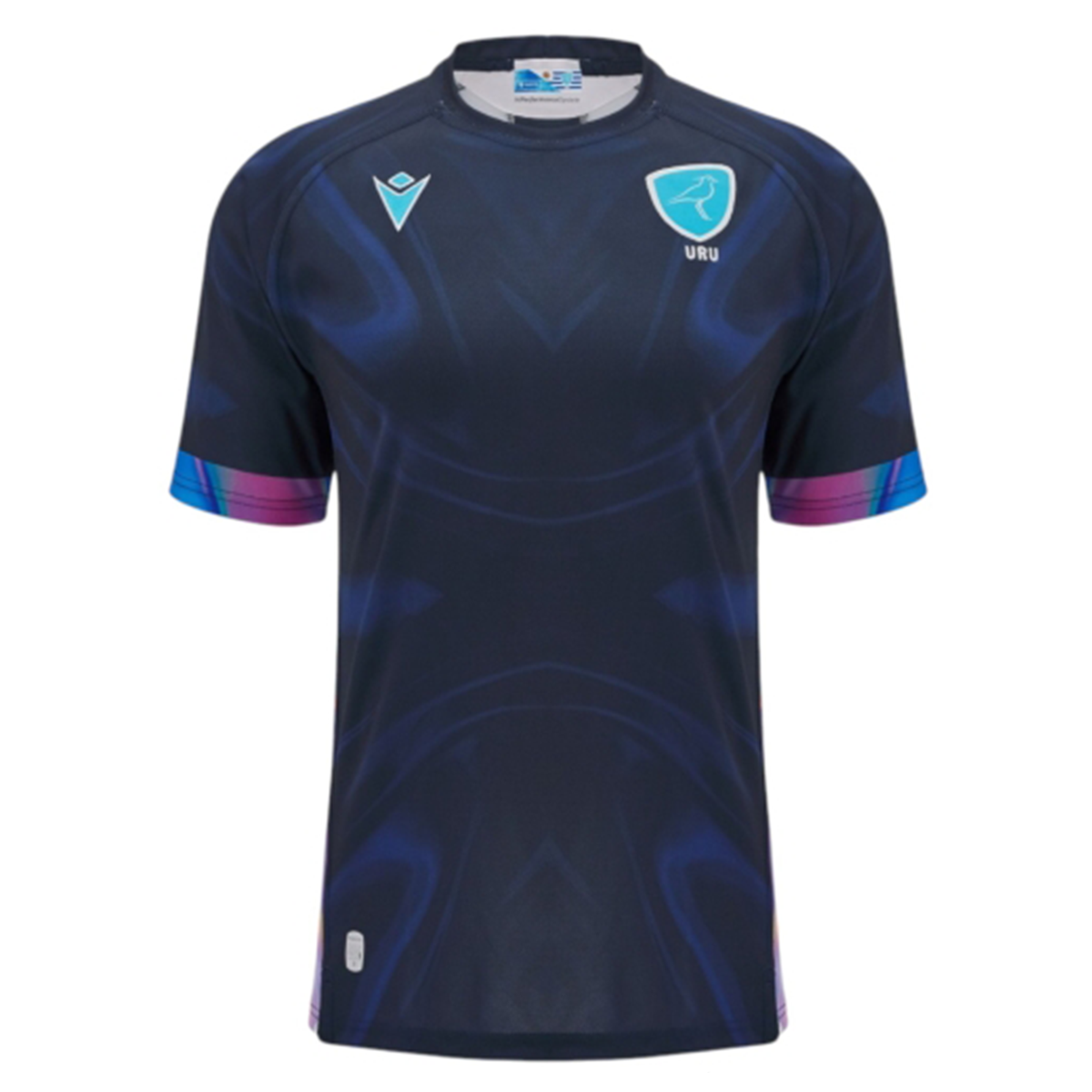 The Uruguay URU 25/26 Replica Training Jersey by Macron features short sleeves, dark blue color with subtle patterns, and light blue URU and Macron logos on the chest.