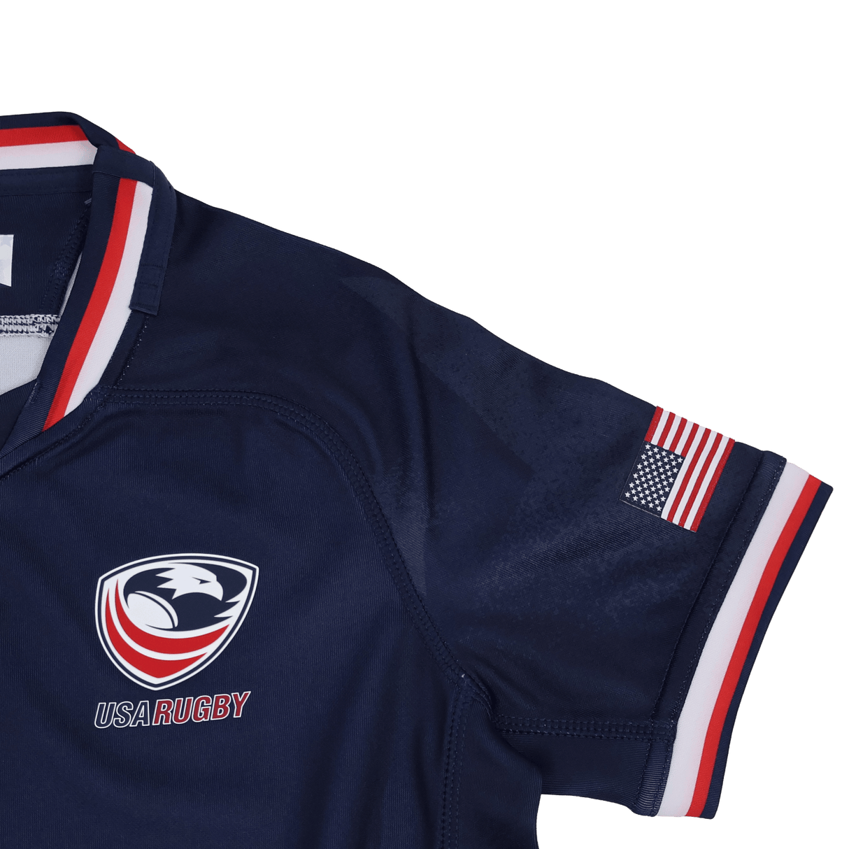 The Youth USA Rugby 24/25 Home WRWC Jersey by Macron features the team's logo on the chest, a small American flag patch on the sleeve, and red, white, and blue trim—perfect for young rugby fans.