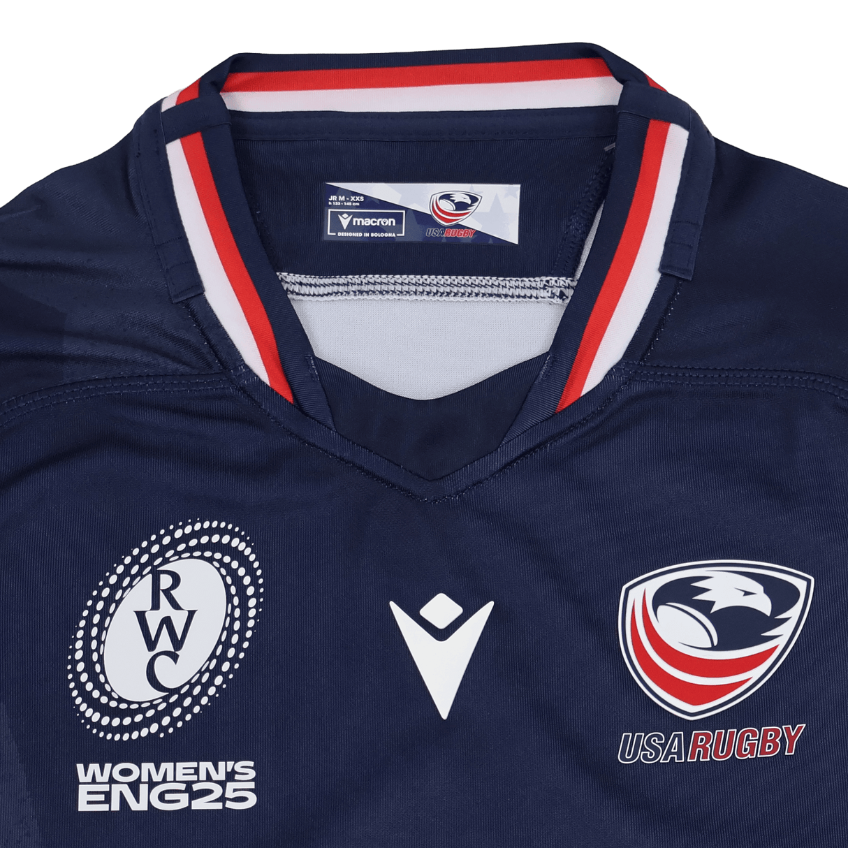 The Youth USA Rugby 24/25 Home WRWC Jersey by Macron features USA Rugby and Women's RWC England 2025 logos, red/white/blue collar detailing, and an official Macron design for comfort and style.