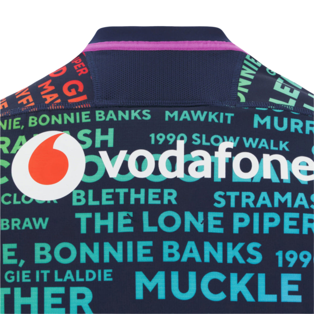 Back of the Scotland 25/26 Rainbow Training Jersey by Macron, displaying the Vodafone logo and vibrant Scottish phrases, celebrating team spirit.