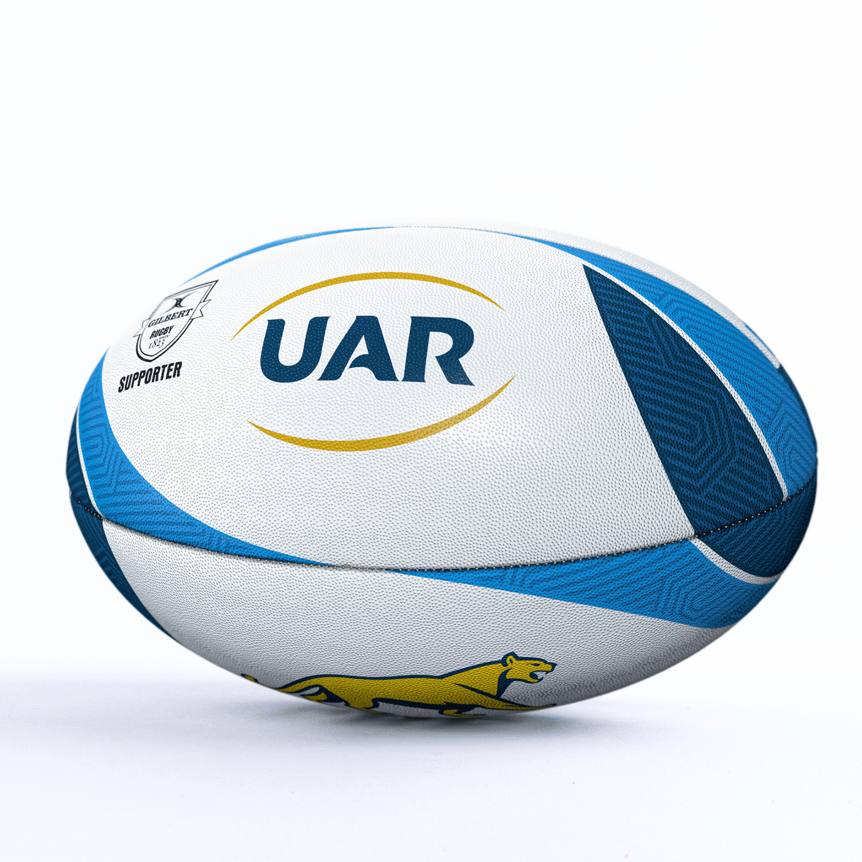A white and blue Argentina Pumas Supporters Ball by Gilbert with "UAR" and a yellow jaguar logo is depicted against a plain white background, perfect for any Argentina Pumas rugby supporters.