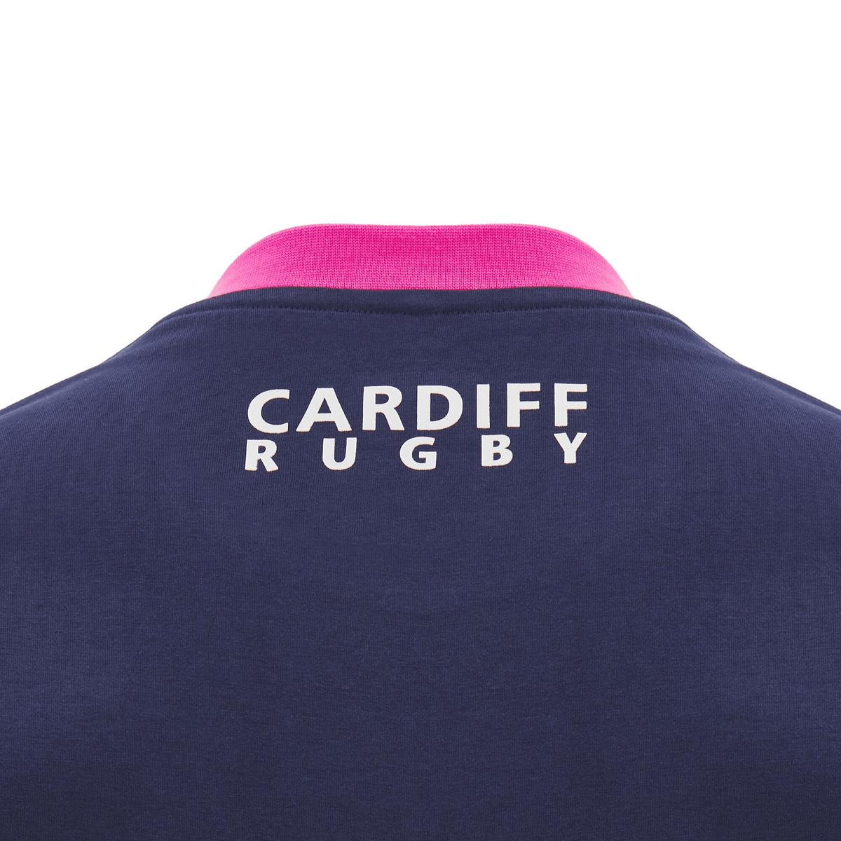 Close-up of a blue Cardiff 24/25 Anthem Travel Cotton T-Shirt by Macron, featuring "CARDIFF RUGBY" printed in white on the back and accented with a pink collar that embodies the spirit of Anthem travel.