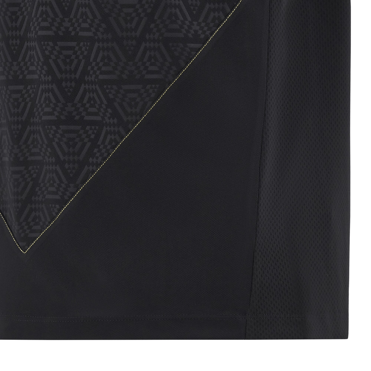 A close-up of the fabric from the Wales 24/25 Travel Polo by Macron reveals a geometric triangle pattern with vibrant yellow stitching.