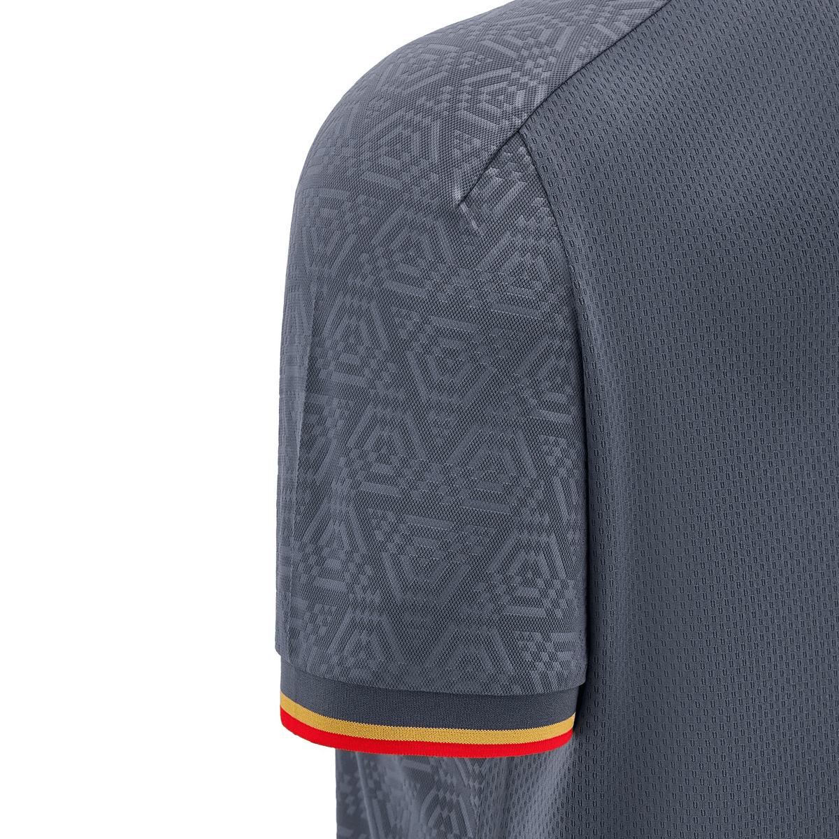 Close-up of the sleeve of the Wales 24/25 Travel Polo by Macron in gray, showcasing geometric patterns with a striped cuff in red, yellow, and black, capturing the essence of Wales.