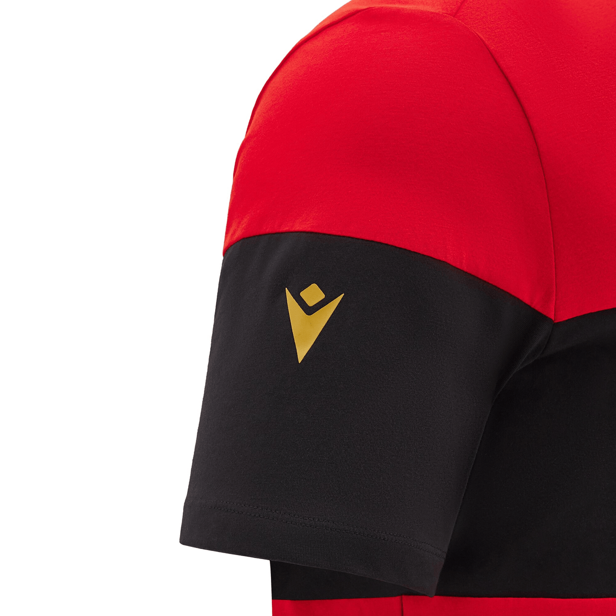 A close-up of the sleeve on the Wales 24/25 CYMRU Leisure T-Shirt by Macron shows off a gold Macron logo against a black background, embodying the spirit of CYMRU in every detail.