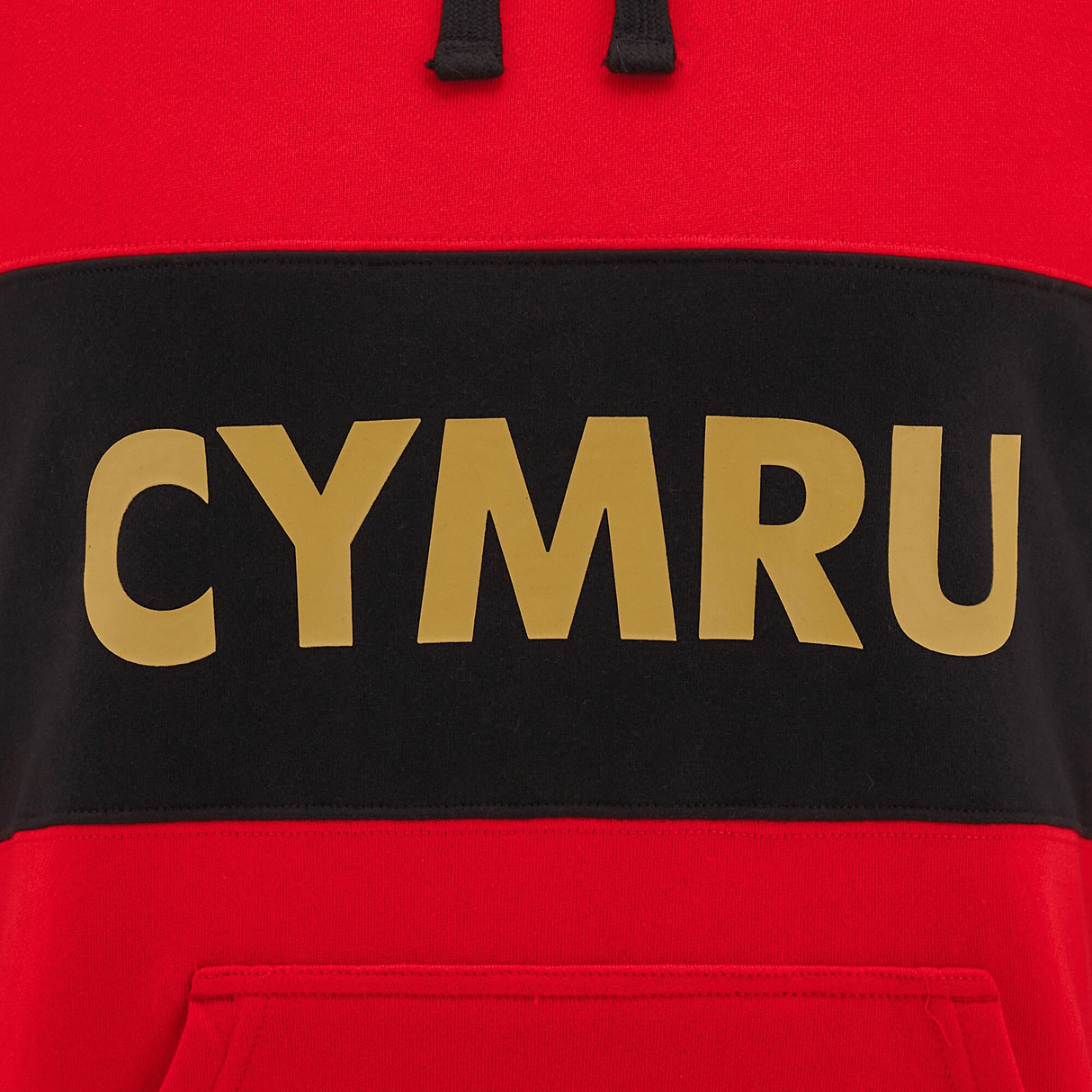 The Wales 24/25 CYMRU Leisure Hoodie by Macron boasts a vibrant red design highlighted with a sleek black stripe and prominent yellow "CYMRU" lettering across the chest, capturing both style and national pride.