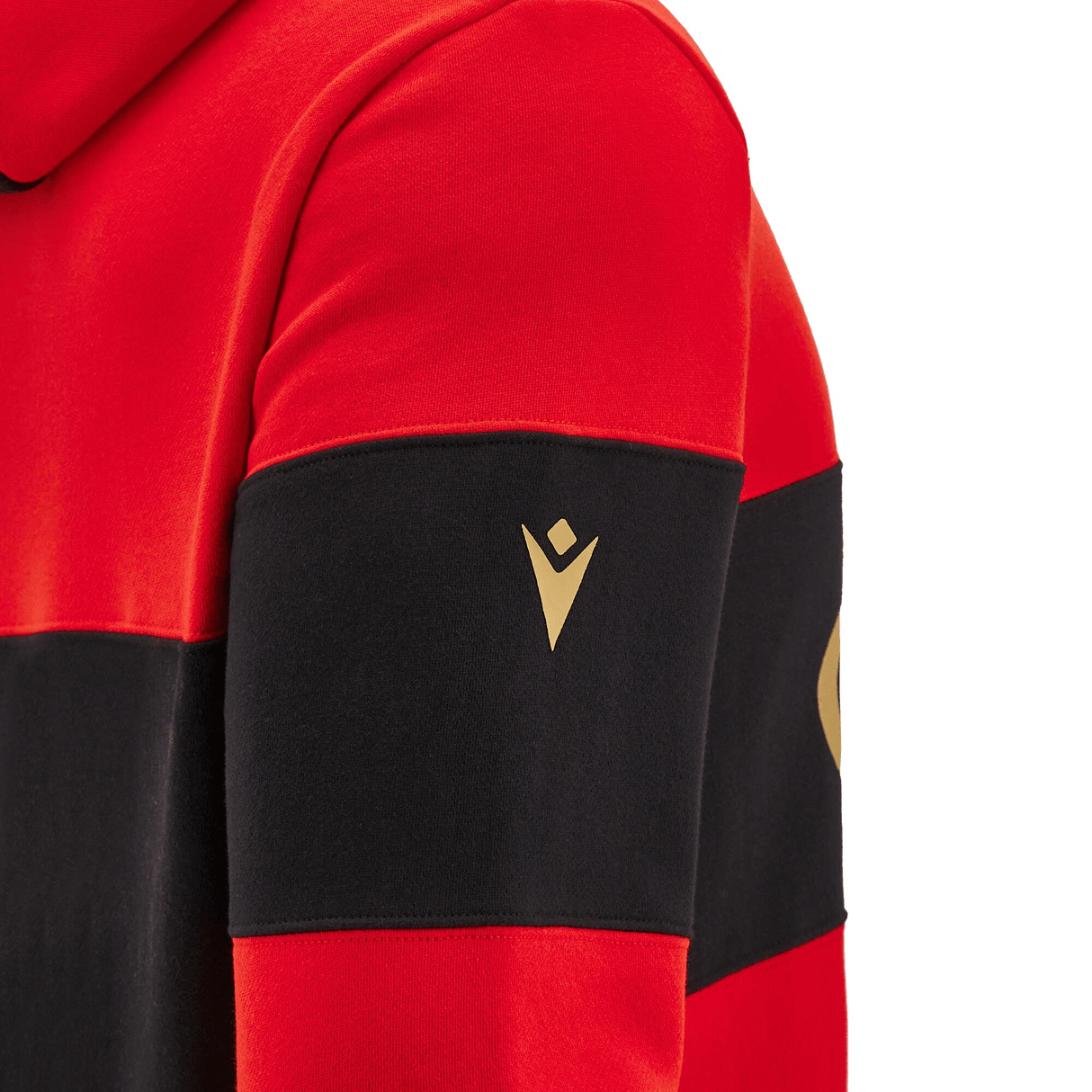 Close-up of a red and black striped shirt sleeve with a small gold logo on the black stripe, reminiscent of the quality found in the Wales 24/25 CYMRU Leisure Hoodie by Macron.
