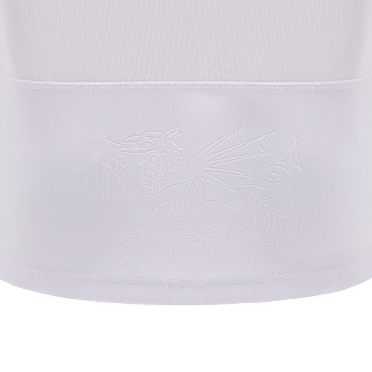 White fabric with an embossed dragon emblem in the center, reminiscent of a classic design featured in the Wales 24/25 6 Nations Replica Away Jersey by Macron.