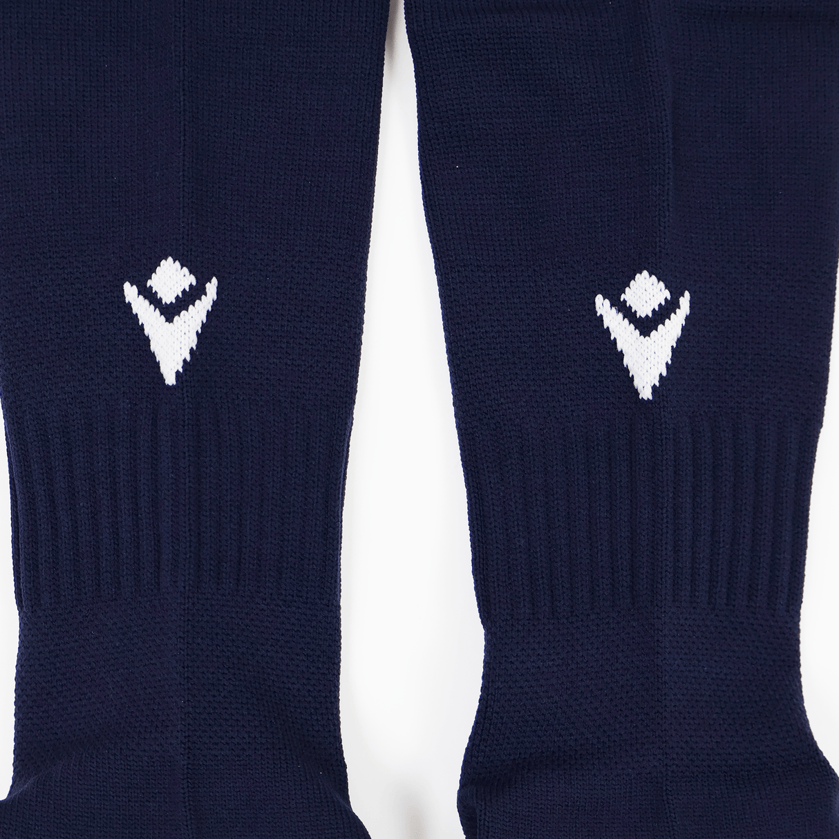 Pair of navy blue USA Rugby 24/25 Player Home Socks by Macron, each featuring a white geometric logo near the cuff, displayed side by side on a white background—ideal performance rugby socks from Macron.