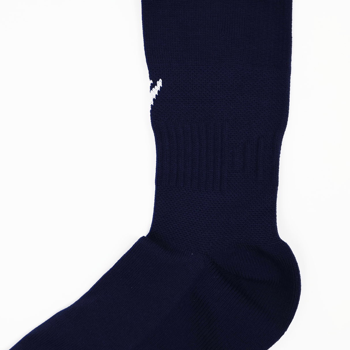 A close-up of the USA Rugby 24/25 Player Home Socks by Macron, featuring ribbed ankle detailing and a small white Macron logo on the side, set against a white background.