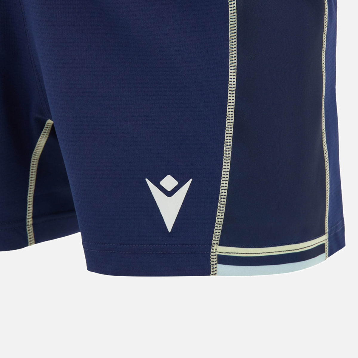 Close-up of the Scotland SRU 26/27 Matchday Home Shorts by Macron in navy blue, featuring contrast stitching and light blue trim detail at the hem. These Macron shorts are crafted with moisture-wicking fabric to help keep you cool and comfortable.