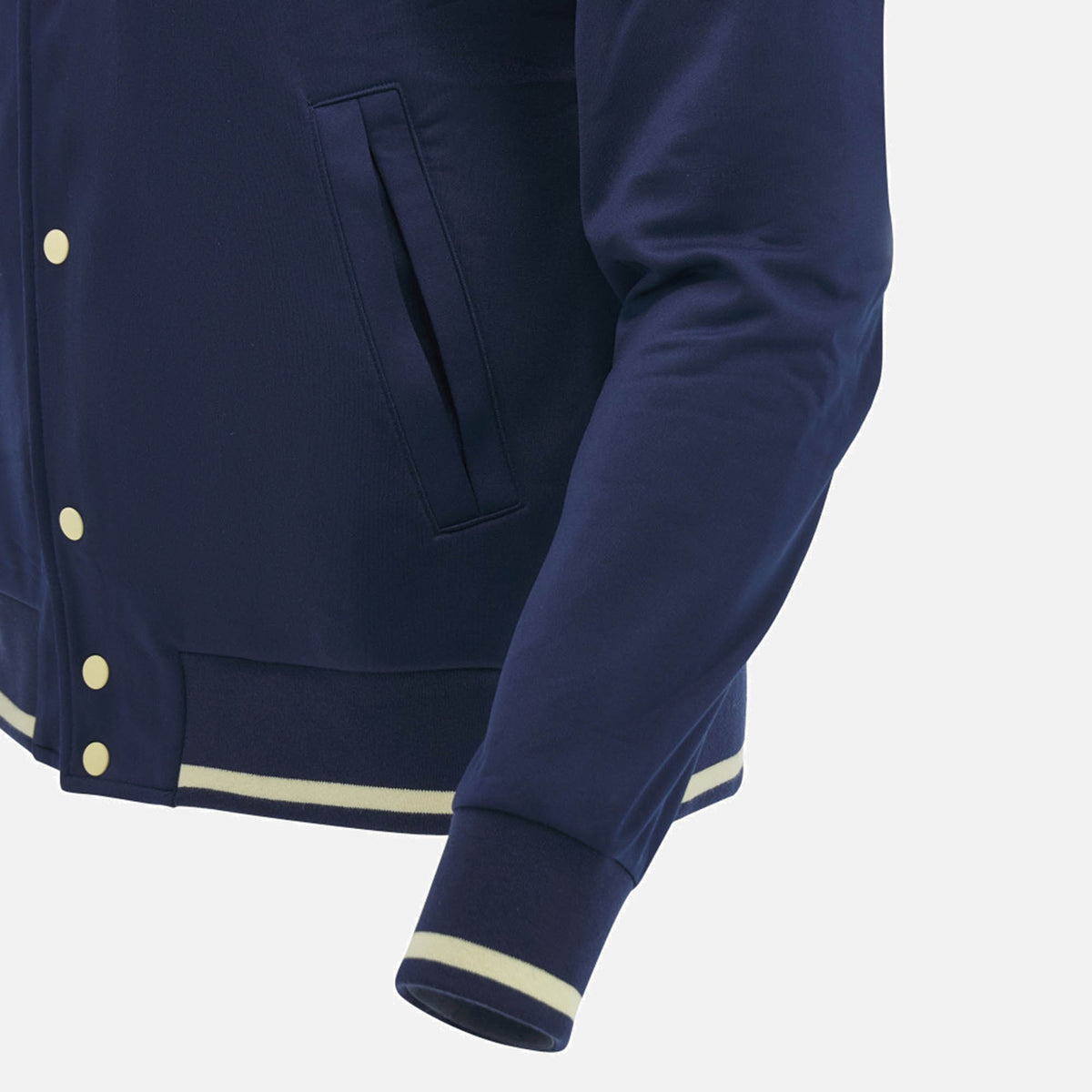 A close-up of the Scotland SRU 26/27 Anthem Varsity Jacket by Macron, a navy blue varsity jacket featuring cream-colored buttons and striped cuffs, hem, and collar, displayed on a white background.