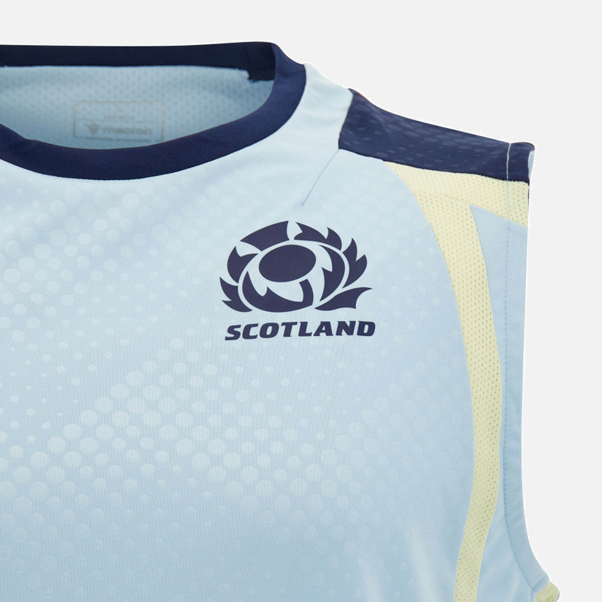 Close-up of the Scotland SRU 26/27 Player Training Singlet by Macron, a sleeveless light blue top featuring the iconic thistle logo and "SCOTLAND" printed on the chest. This official Macron singlet combines athletic style with team pride for the 2026/27 season.