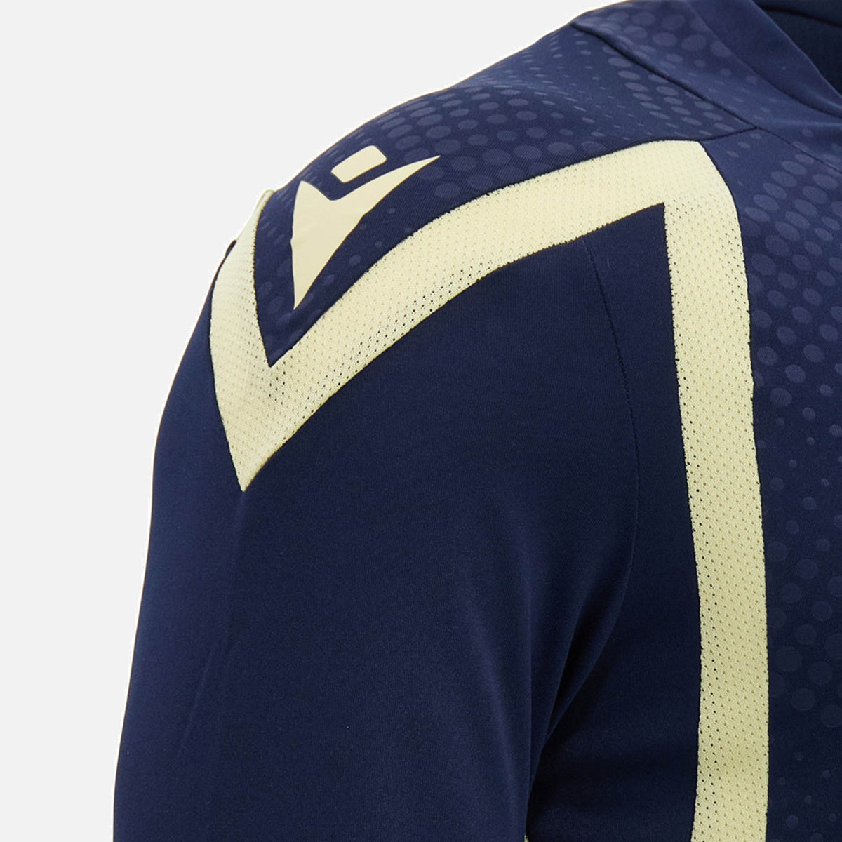 Close-up of the Scotland SRU 26/27 Player Training Shirt by Macron, a navy blue training top featuring pale yellow geometric patterns on the shoulder and sleeve, showcased against a plain background.