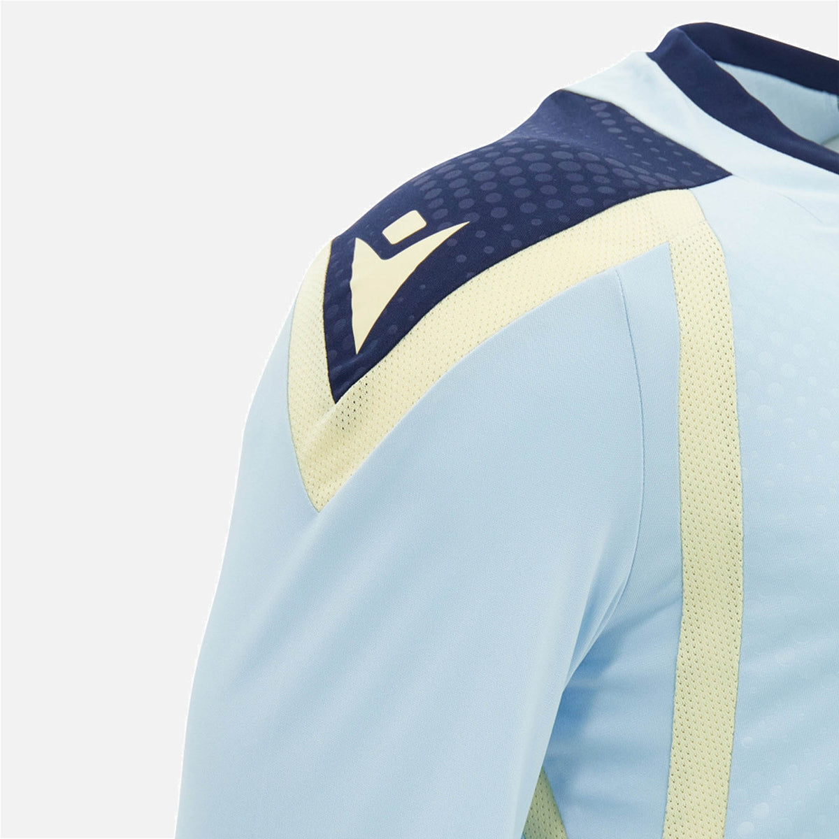 Close-up of the Scotland SRU 26/27 Player Training Shirt by Macron in light blue, featuring navy and pale yellow shoulder accents and a white geometric Macron logo.