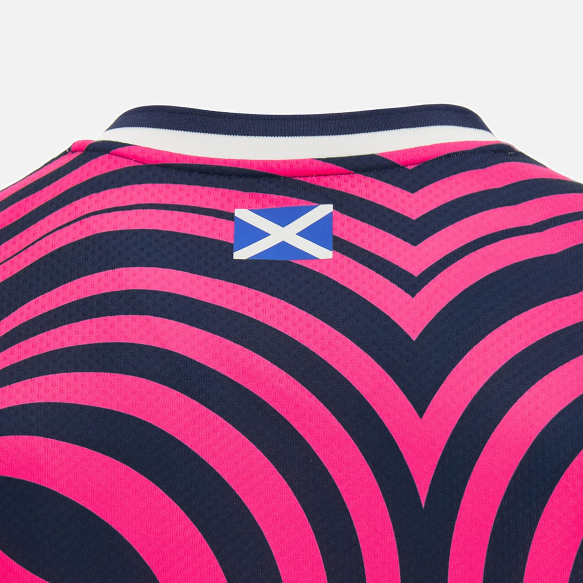 Back of a dark blue Scotland SRU 26/27 basketball singlet with curved pink stripes and a small Scottish flag below the collar, designed by Macron.