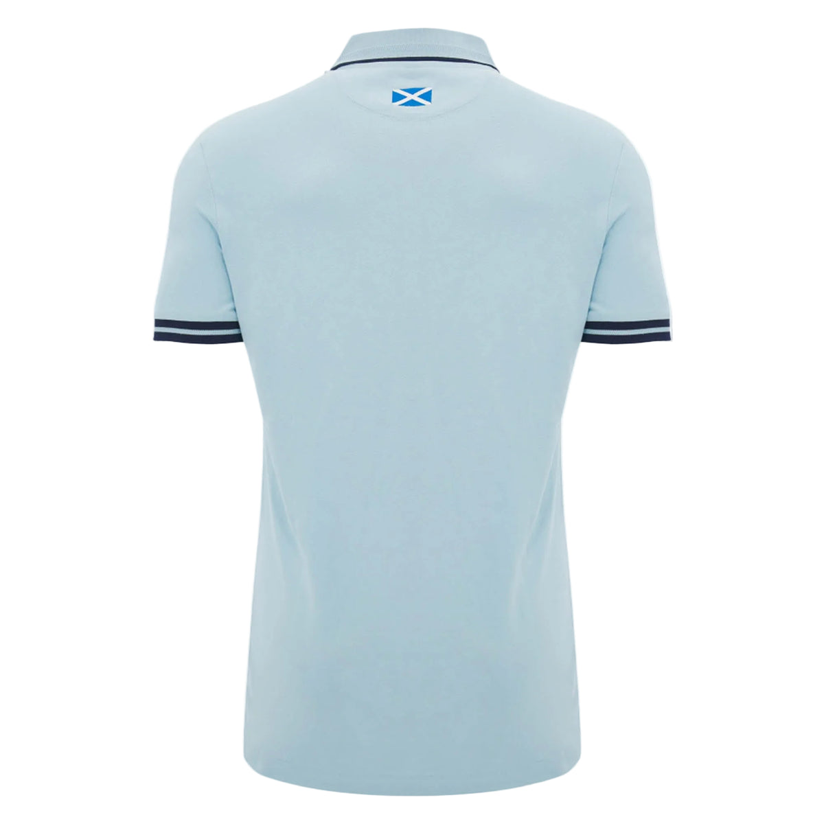 The Scotland SRU 26/27 Travel Polo by Macron is shown from the back in light blue, featuring a small Scottish flag beneath the collar and dark stripes on the sleeve cuffs.