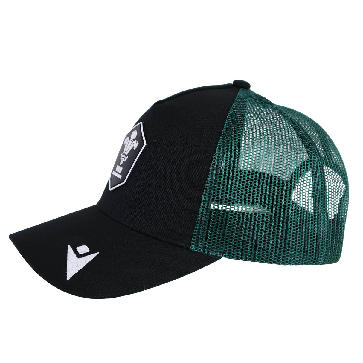 The Wales WRU 26/27 Trucker Cap by Macron features black and green mesh panels, a white emblem on the front, and a logo on the brim. Shown in left side profile, this stylish cap is crafted with quality by Macron—perfect for Wales Rugby supporters.