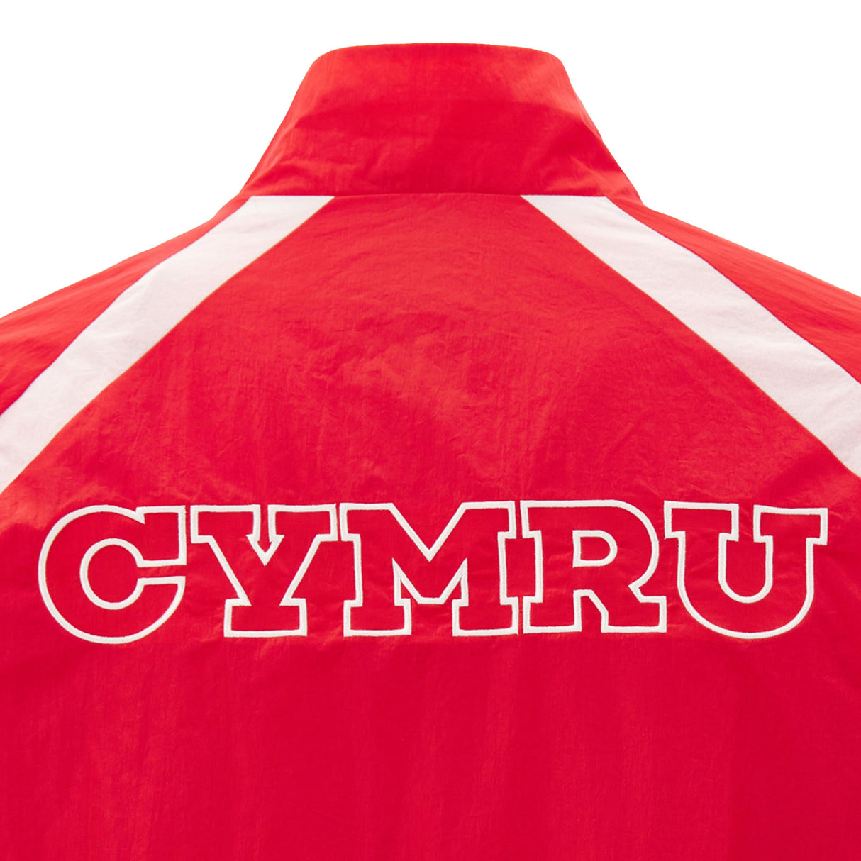 The Wales WRU 26/27 Heritage Retro Jacket by Macron is a classic red rugby jacket with white shoulder stripes and bold “CYMRU” lettering on the back, inspired by vintage Wales WRU designs.