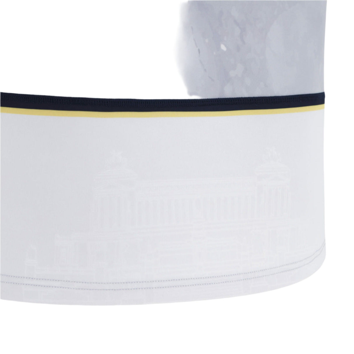 Close-up of a white fabric band from the Italy 25/26 Replica Away Jersey by Macron, showing a dark and gold stripe at the top and a faint architectural pattern.