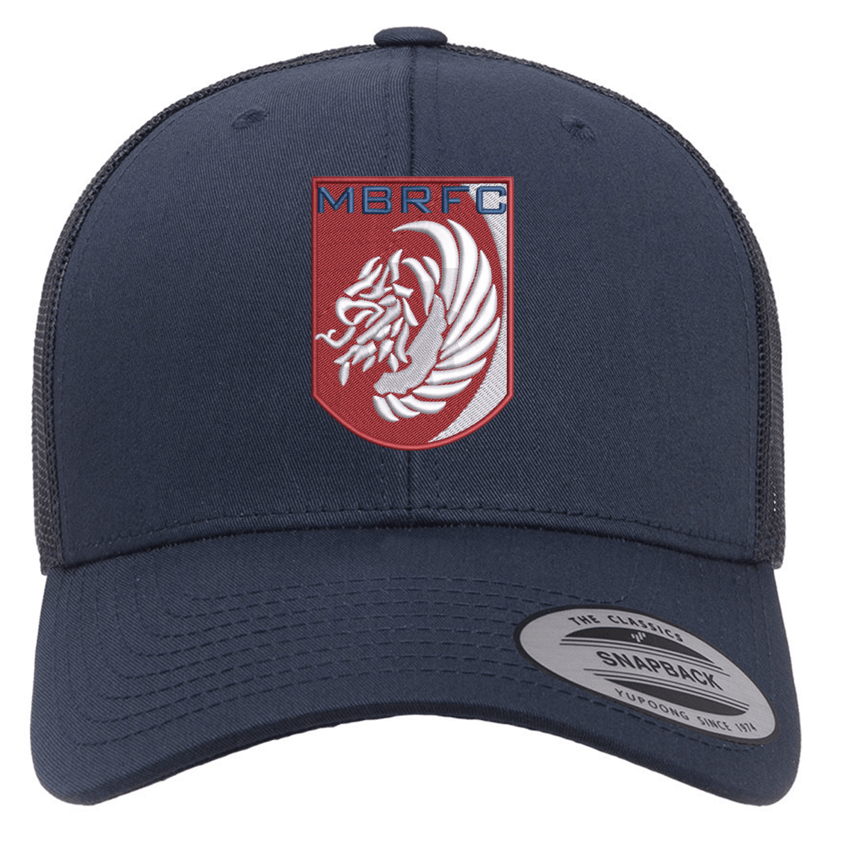 The Montgomery Bucks Griffins Retro Trucker Cap by EMB S&S Activewear is a navy hat with a mesh back, snapback closure, and a red and white MBRFC lion logo patch embroidered on the front.