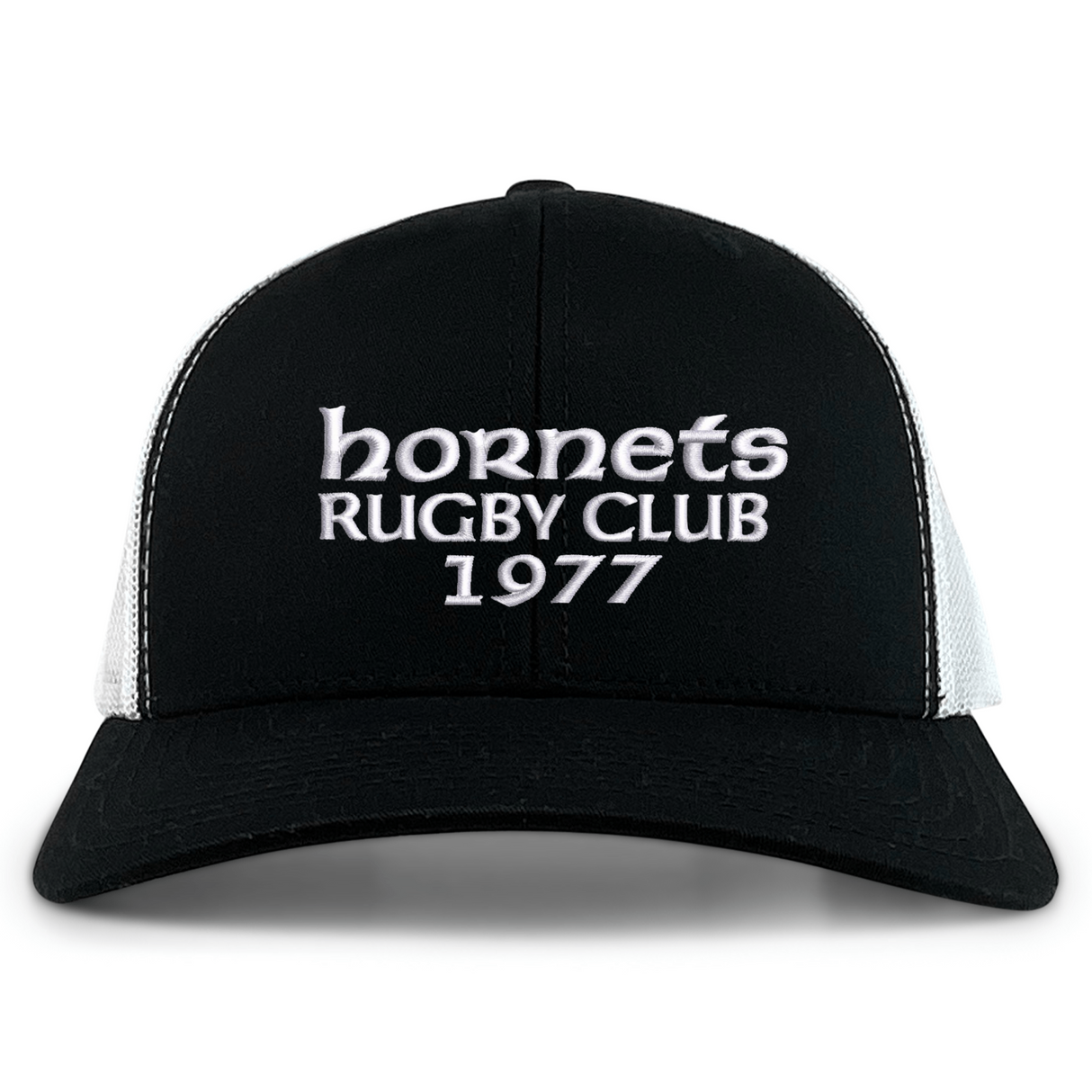 The Hornets Rugby Club 1977 Retro Trucker Cap by EMB S&S Activewear features an embroidered "hornets RUGBY CLUB 1977" design on the front, classic black and white color styling, and a comfortable snapback closure for an adjustable fit.