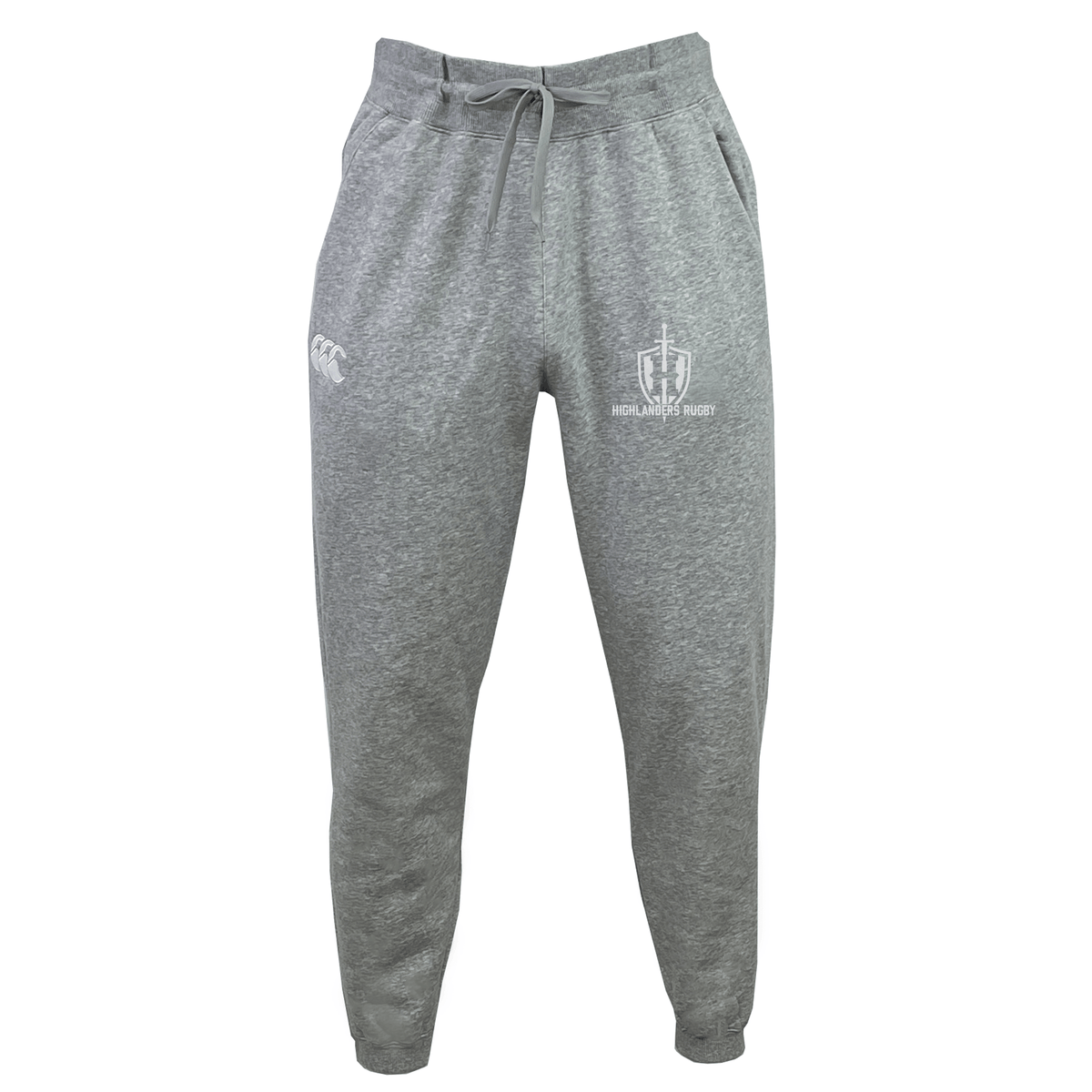 The Highlanders Rugby NC Leisure Sweatpant by Canterbury, made from gray organic cotton, features an elastic waistband and drawstring. The sweatpants have logos on both legs: a sports team's crest on the right leg and the manufacturer's emblem on the left leg.