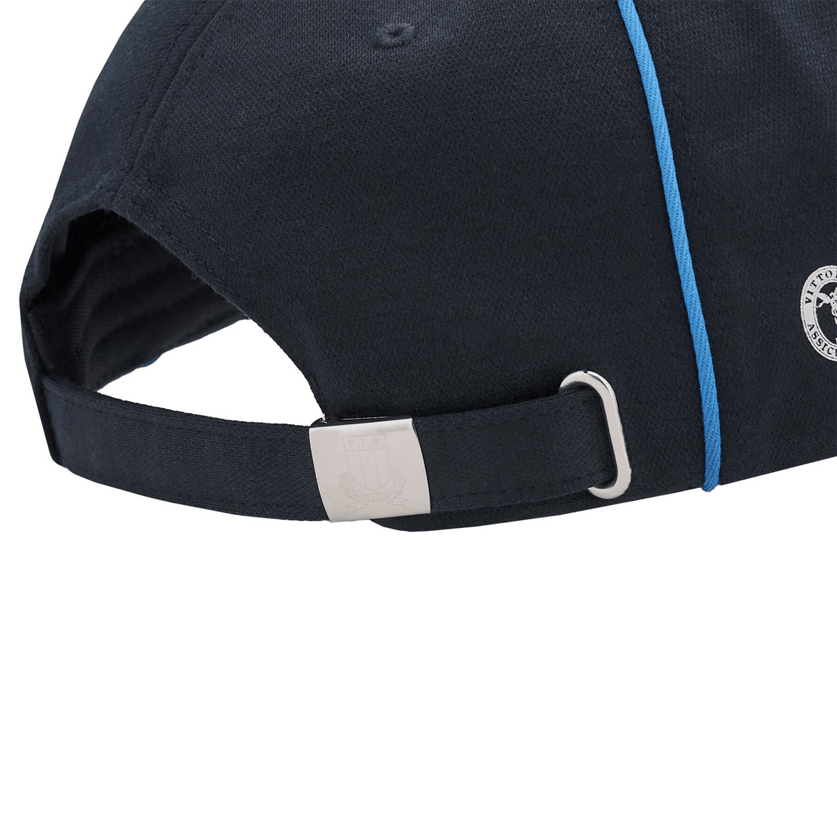 The Italy Curved Visor Cap 24/25 by Macron is crafted with a sleek black design, highlighted by a blue stripe along the side. Created with comfort in mind, it includes an adjustable strap with a metal buckle at the back, embodying European elegance in everyday style.