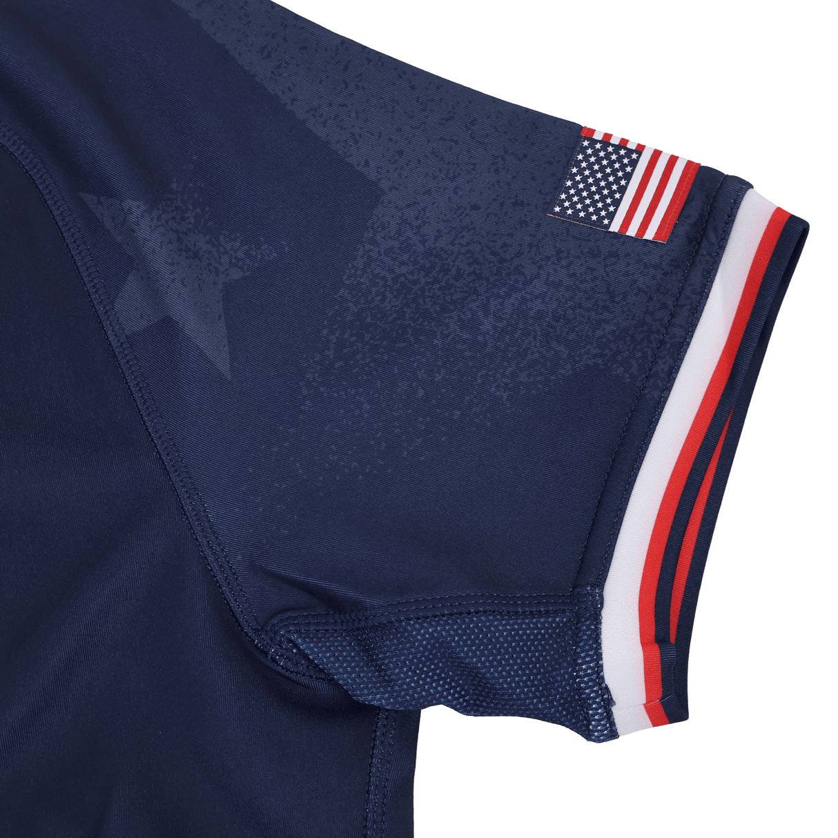 Close-up of the Women's USA Rugby 24/25 Home Body Fit Jersey by Macron, highlighting a subtle star pattern, American flag patch, and red, white, and blue cuff trim—showcasing the signature fit from Macron.