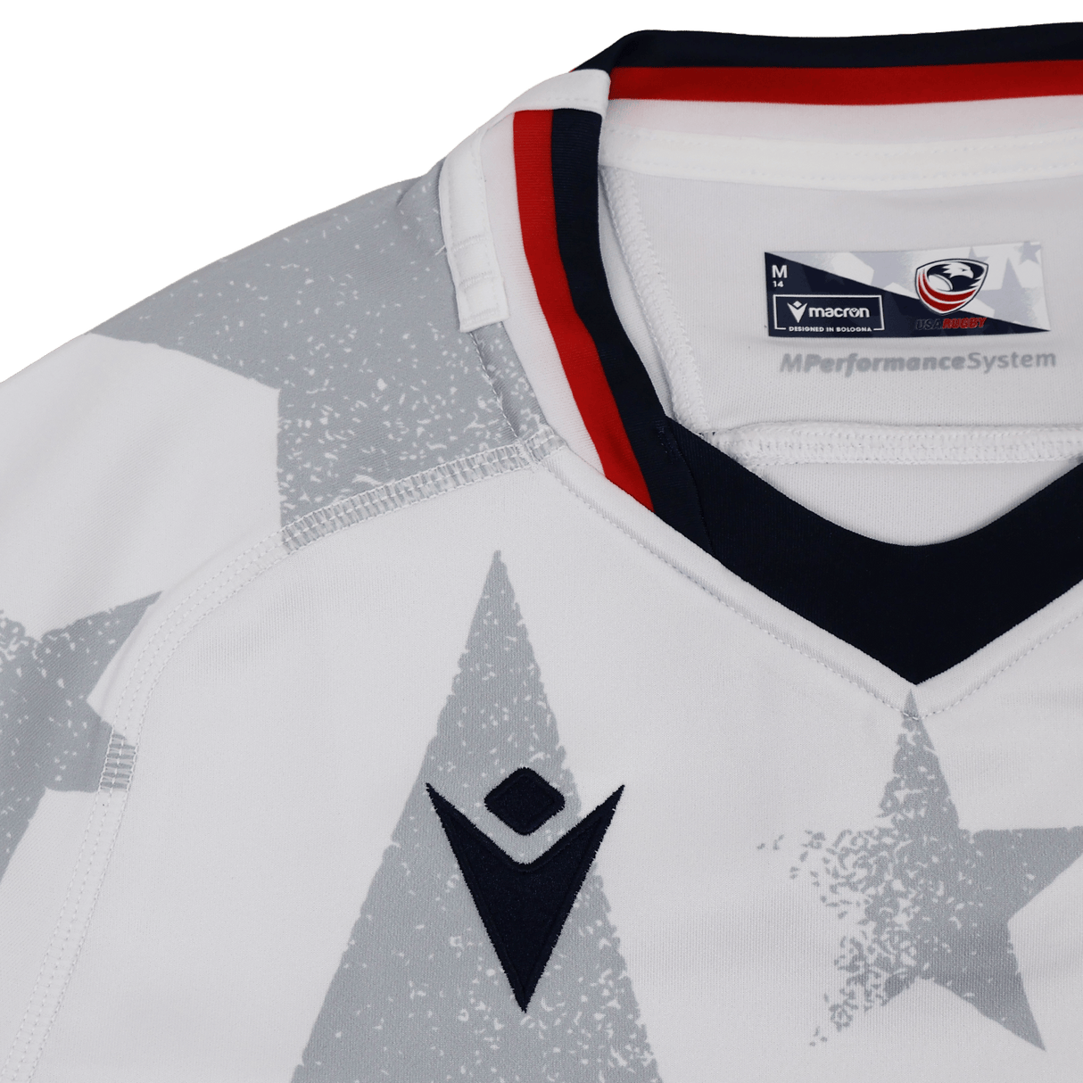 Close-up of the Women's USA Rugby 24/25 Away Body Fit Jersey by Macron, featuring the USA Rugby badge, star pattern, and red and navy collar trim—a premium rugby performance shirt.