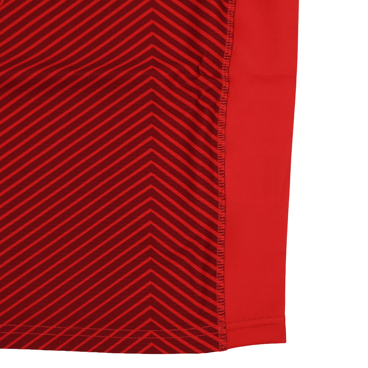 The Youth USA Rugby Training Jersey by Macron features red fabric with diagonal dark red stripes on the left, solid red on the right, and a stitched seam near the right edge—ideal for young rugby players.
