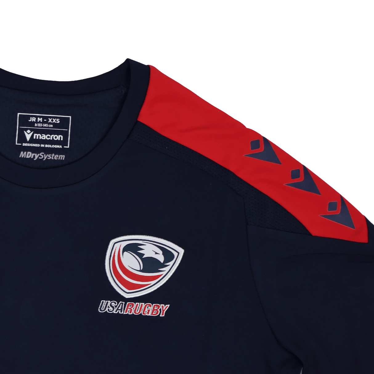 The Youth USA Rugby 24/25 Training Poly Shirt by Macron features a navy blue design, red shoulder accents, a white eagle logo, and Macron branding—ideal for youth rugby training.