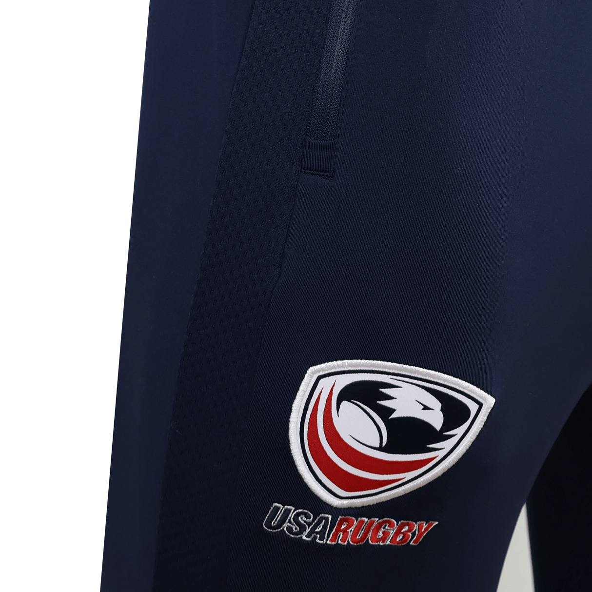 The USA Rugby 25/26 Training Fitted Pant by Macron features a bold "USA RUGBY" logo with an eagle emblem on the thigh—ideal athletic pants for dedicated fans and athletes.