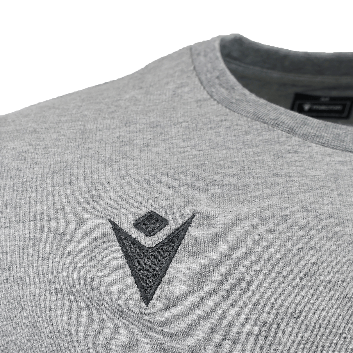 Close-up of the USA Rugby 25/26 Player Travel Sweatshirt by Macron in heather gray, featuring a crew neck and a small, embroidered dark gray geometric logo on the chest.