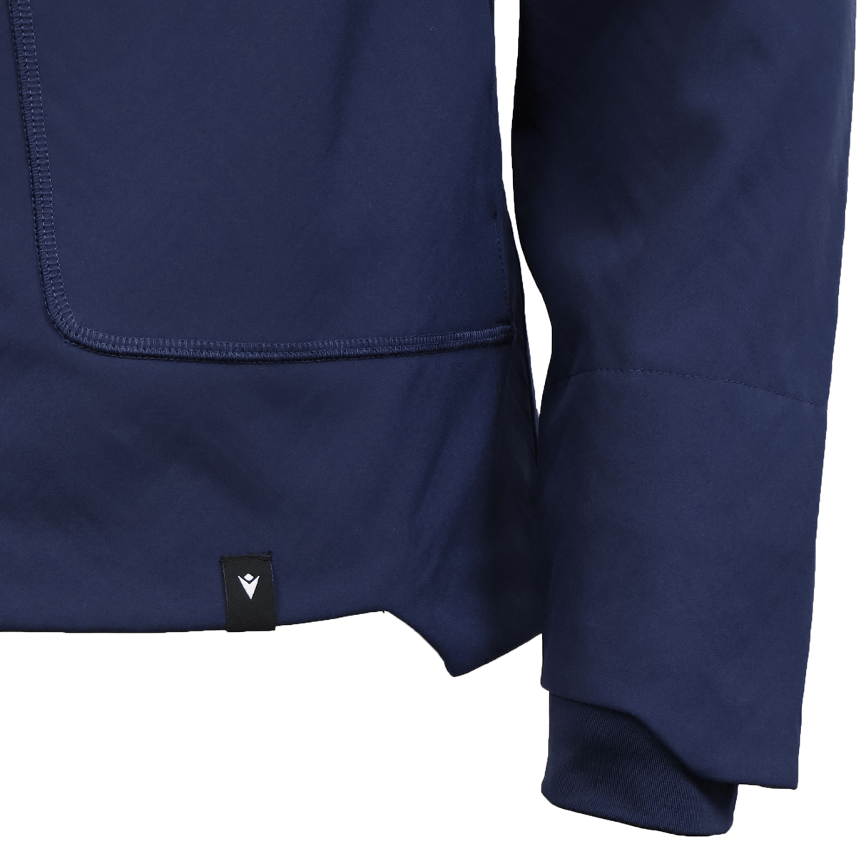 Close-up of the USA Rugby 25/26 Athleisure Softshell Jacket by Macron in navy blue, showcasing its pocket, sleeve, and a small black tag with a white emblem. This Macron jacket combines water resistance with athleisure style.