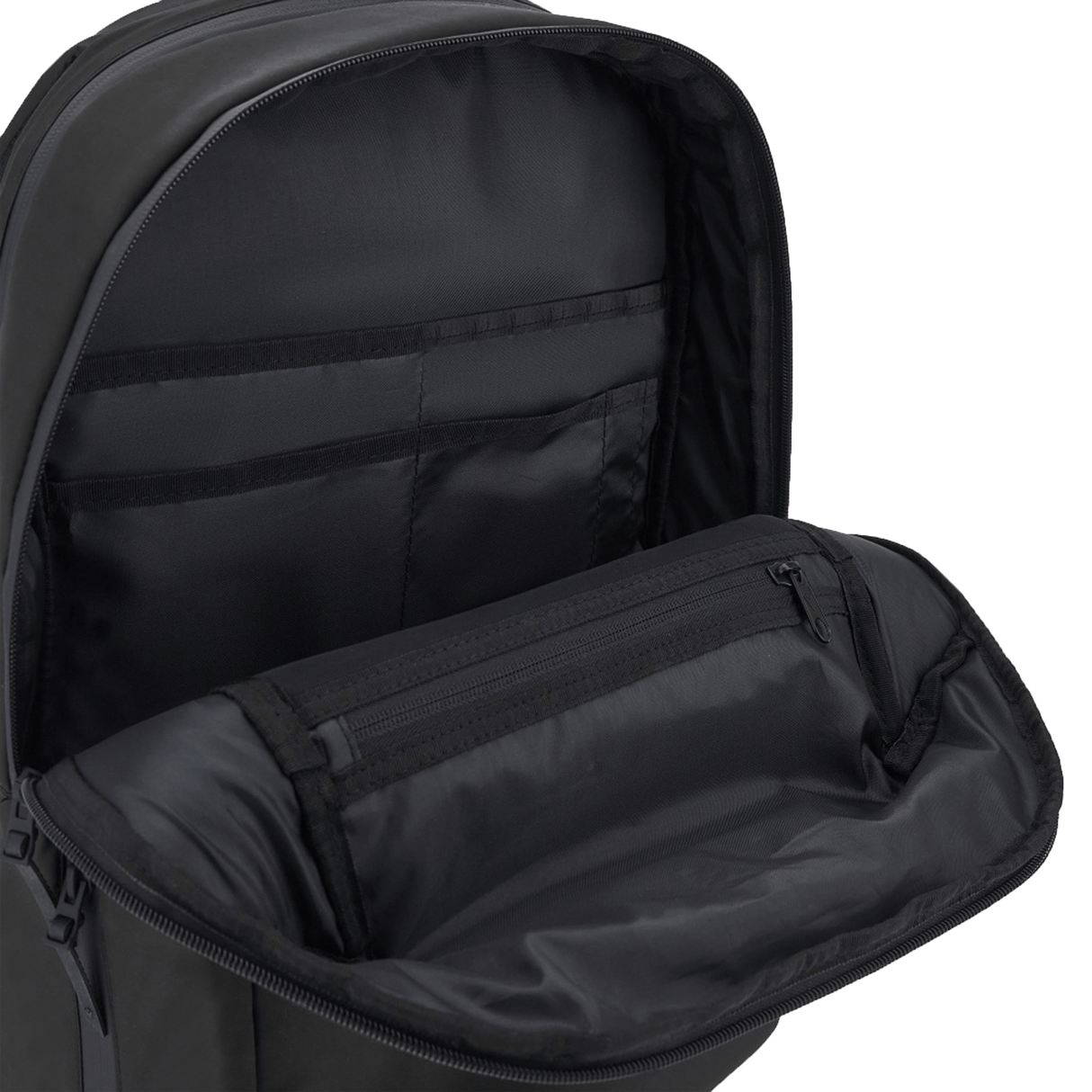 A close-up of the open USA Rugby 25/26 Staff Backpack by Macron displays its interior compartments and zippered pocket.