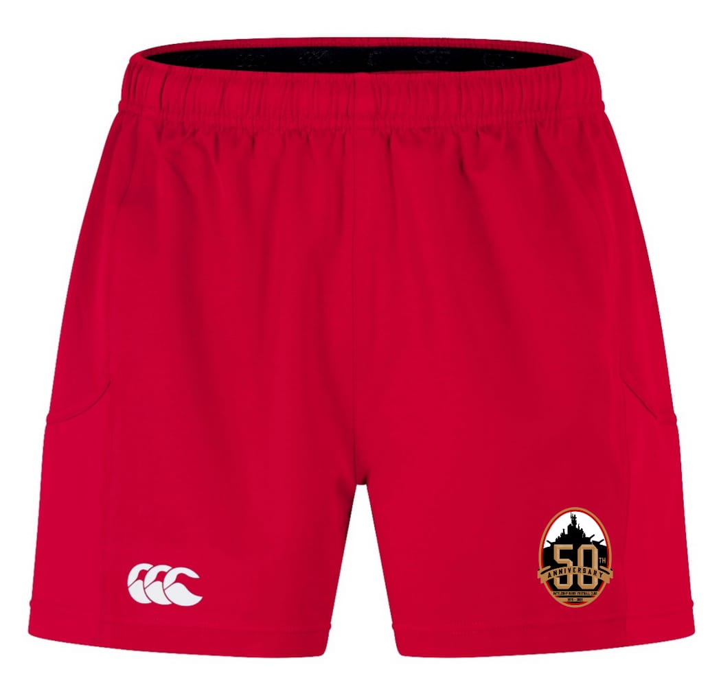 The EMB Canterbury Battleship Rugby Club 50th Anniversary Advantage Short 2.0 features an elastic waistband, side pockets, a white Canterbury logo, and a black and gold anniversary patch—sustainable shorts made for comfort and performance.