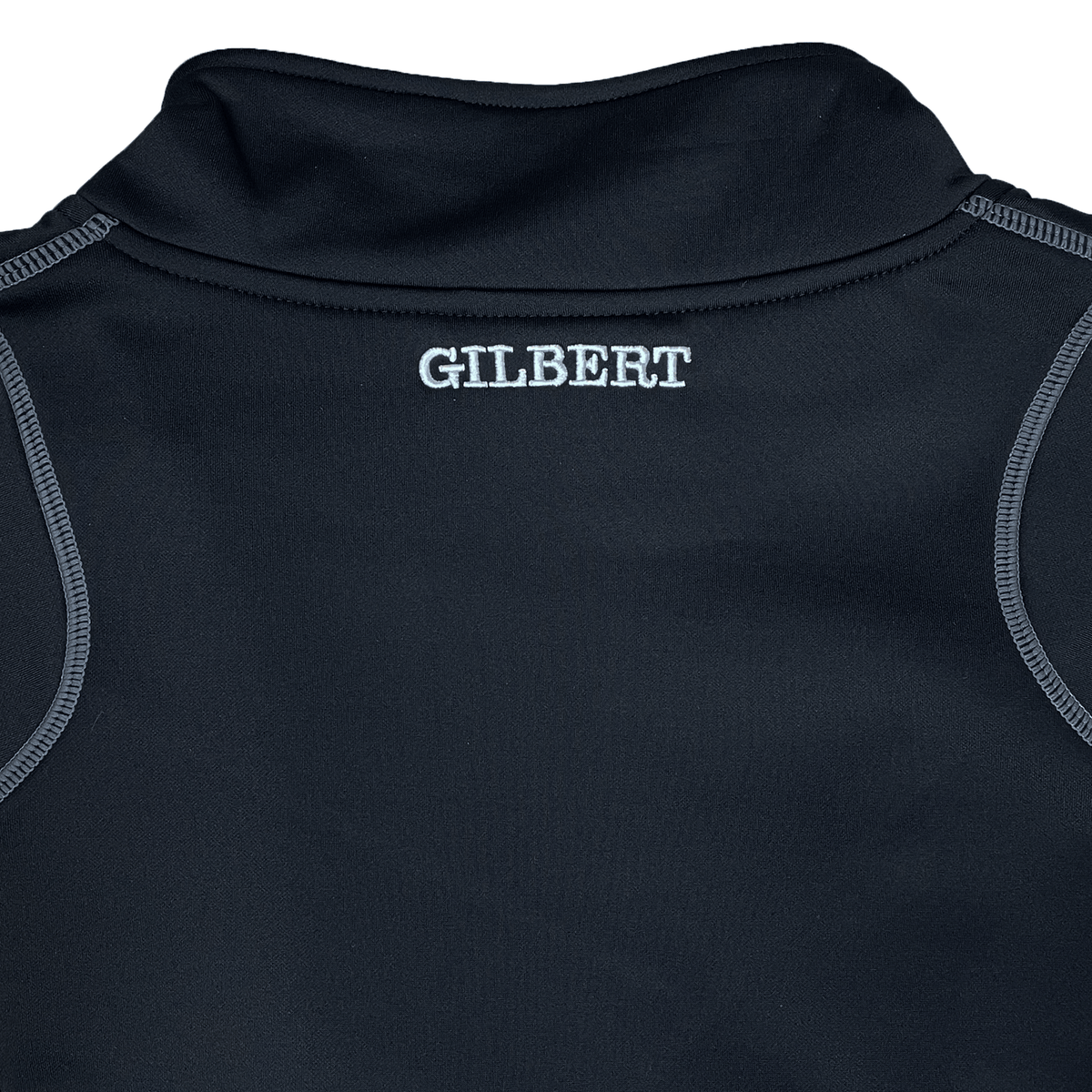 The back of a black Gilbert Quest 2 1/4 Zip Fleece Top features "GILBERT" in white near the collar, crafted from micro-polyester for enhanced mobility.