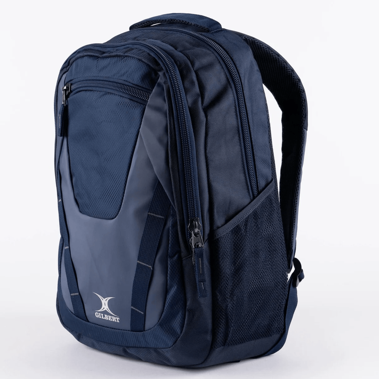 The Gilbert Club V4 Rucksack Backpack by Gilbert is a navy blue bag with zippered compartments, mesh side pockets, top handle, and shoulder straps, shown against a plain white background.