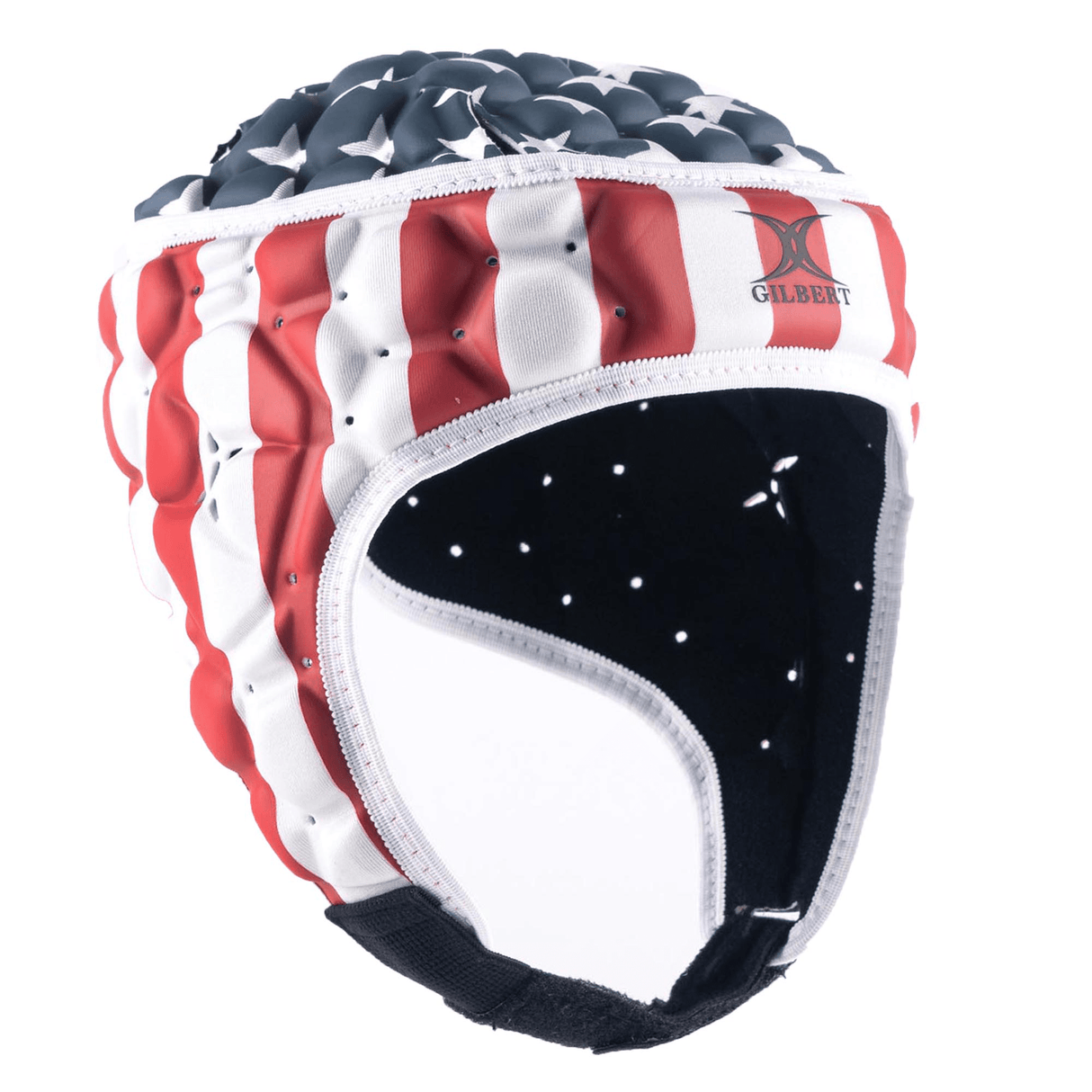 A padded rugby scrum cap, the Gilbert USA Stars and Stripes XP 250 Headguard by Gilbert, featuring an American flag design with red and white stripes and white stars on a blue field, is displayed against a white background. This headguard provides not only patriotic flair but also advanced hex padding for optimal protection.