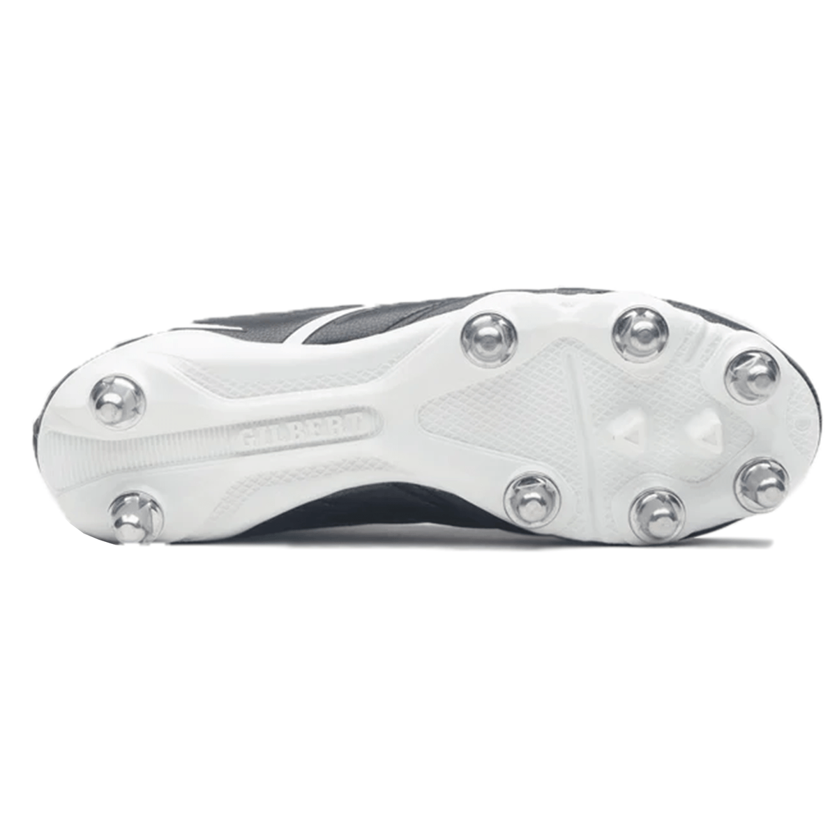 The image features the sole of the Gilbert Sidestep X20 8S Power SG - Black/White sports shoe from Gilbert, designed for power performance on soft ground. The metallic cleats are arranged in a hexagonal pattern.