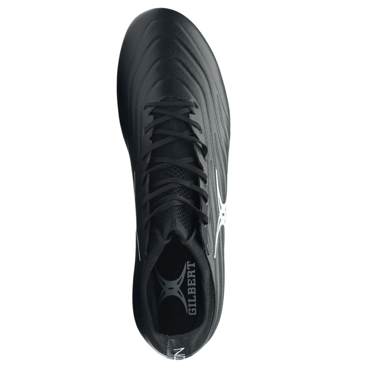 Top view of the Gilbert Icon X 6S SG rugby boot in black with white accents and "GILBERT" branding on insole and side—designed as soft ground boots for superior grip on wet pitches.