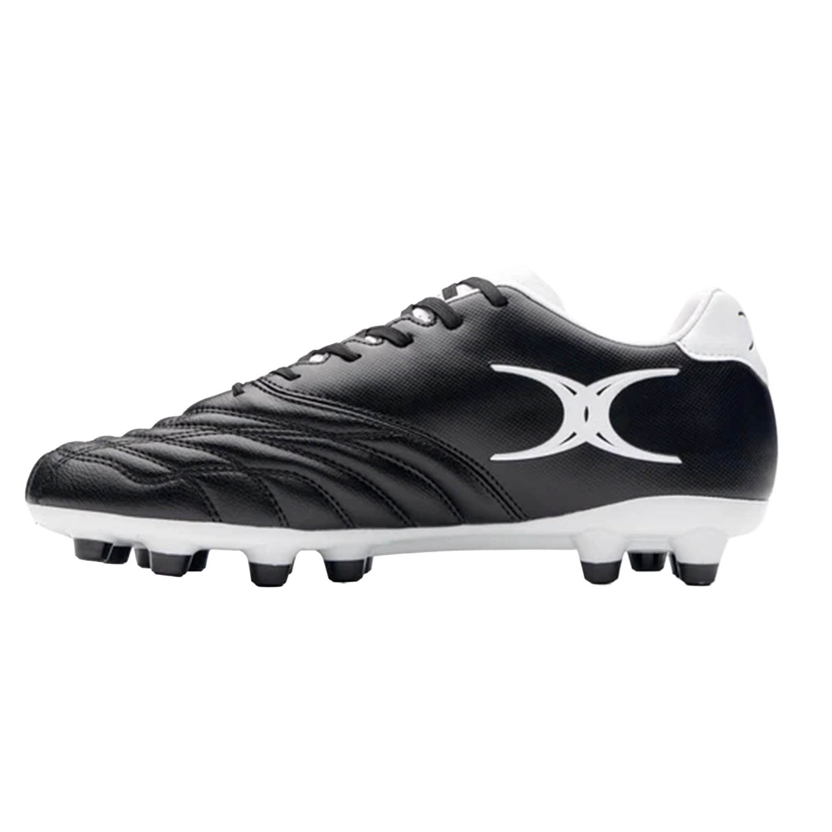 Sidestep Icon MSX by Gilbert soccer cleat in black and white, featuring a synthetic leather upper, white laces, a contrasting white heel, and a stylized white Gilbert logo on the side, shown from the left against a plain background.