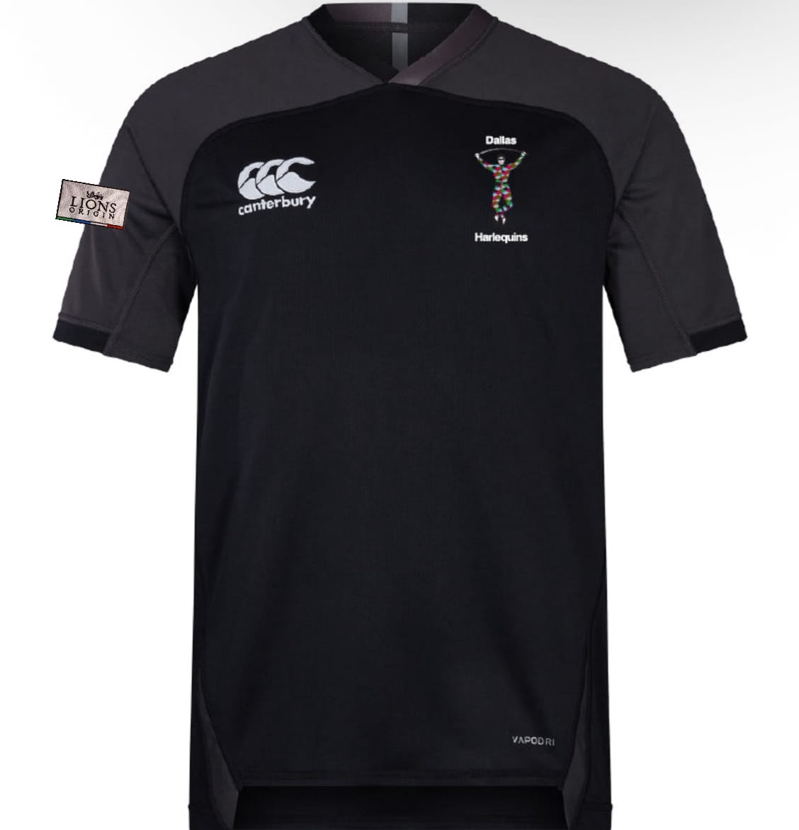 The Dallas Harlequins Lions Origin Vapodri Evader Jersey by EMB Canterbury is a black short-sleeve rugby top featuring moisture-wicking tech, team and Canterbury logos on the front, and a "Lions" patch on the left sleeve.