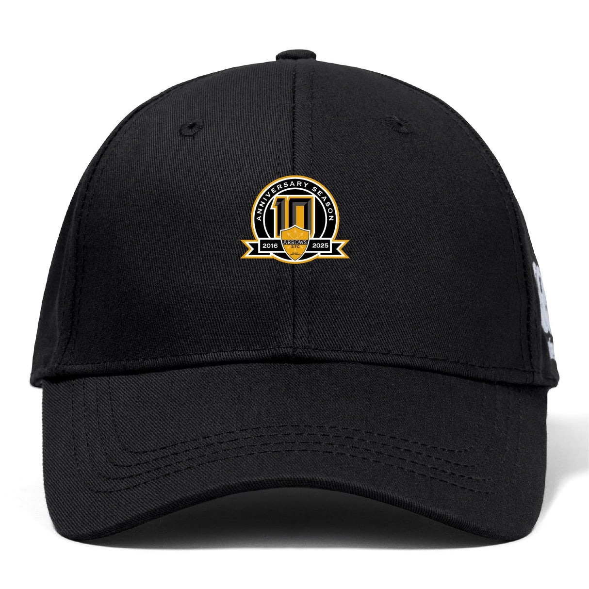 The Arrows Rugby Club 10th Anniversary Flexfit Drill Cap by EMB Canterbury features a gold, white, and black "10th Anniversary Season 2014-2023" embroidered logo on the front.